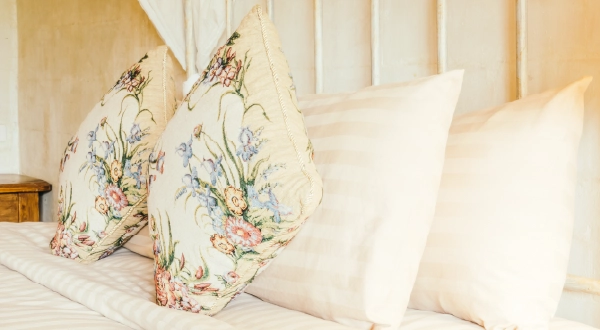 Floral pillows on bed